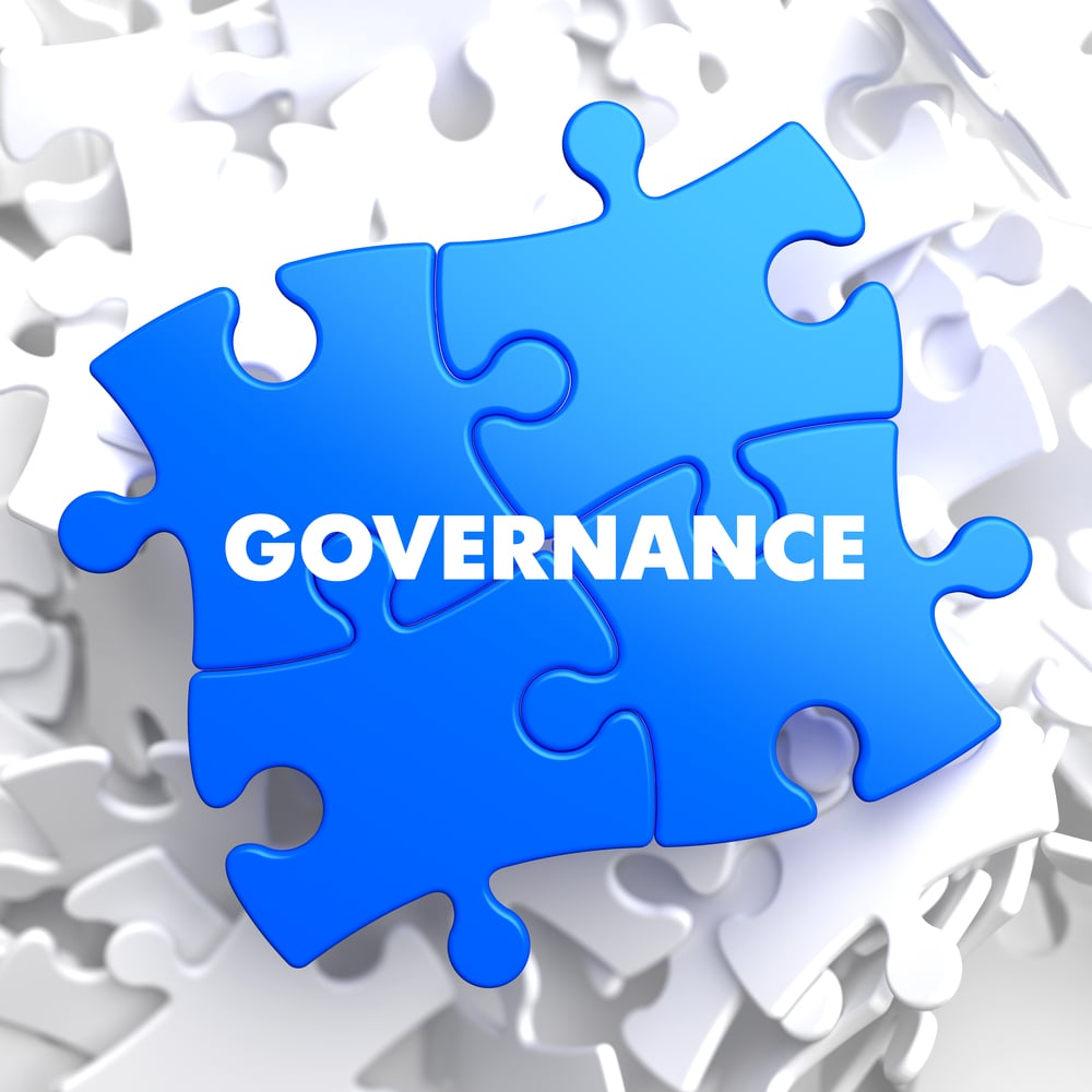 Governance on Blue Puzzle on White Background.